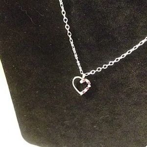 1 /2" heart with crystals & rubies.on 23" chain